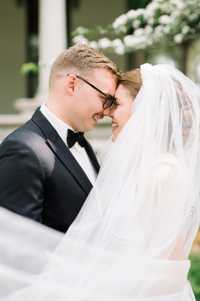 Bride and Groom portrait at Peterson Dumesnil House Wedding with sweeping veil 