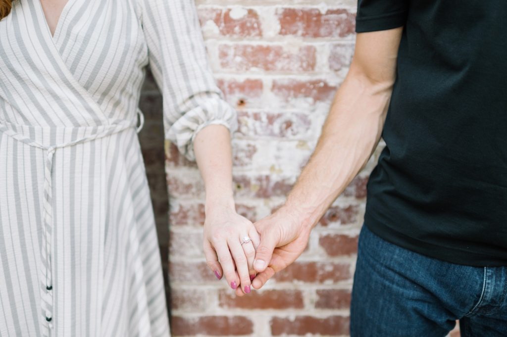 Ponce City Market holding hands showing engagement ring